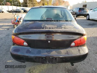 1999 Hyundai Elantra z VIN KMHJF25F9XU833791, wystawiony jako Copart lot #77899654 z przebiegiem 60 396 mil mil oraz Szkoda całkowita • Salvage title. Historia ofert i sprzedaży dostępna na DreamBid. Obrazek 6.