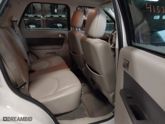 2009 Mercury Mariner Premier with VIN 4M2CU87779KJ14155, listed as a IAAI auction lot 41520138 with 175,980 mi miles. Bid and sale history available at carsss.com. Image 8.
