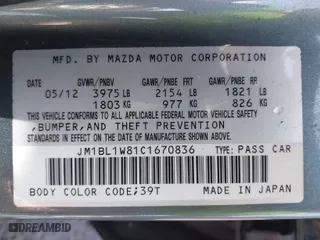 2012 Mazda Mazda3 i Grand Touring with VIN JM1BL1W81C1670836, listed as a IAAI auction lot 41885507 with 242,280 mi miles. Bid and sale history available at carsss.com. Image 9.