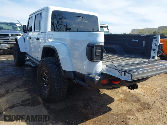 2021 Jeep Gladiator Rubicon with VIN 1C6JJTBG4ML536085, listed as a IAAI auction lot 41898204 with 39,627 mi miles and . Bid and sale history available at DreamBid. Image 3.