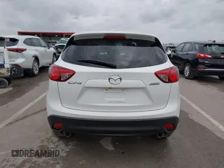 2015 Mazda CX-5 Touring with VIN JM3KE2CY3F0550624, listed as a IAAI auction lot 41931268 with 51,588 mi miles and . Bid and sale history available at carsss.com. Image 16.