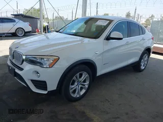 2015 BMW X4 xDrive28i with VIN 5UXXW3C5XF0M89259, listed as a IAAI auction lot 42553903 with 98,960 mi miles and . Bid and sale history available at DreamBid. Image 18.