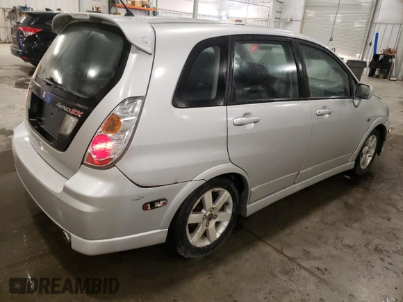2005 Suzuki Aerio SX z VIN JS2RC61H555300879, wystawiony jako Copart lot #80481084 z przebiegiem 129 196 mil mil oraz Szkoda całkowita • Salvage title. Historia ofert i sprzedaży dostępna na DreamBid. Obrazek 3.