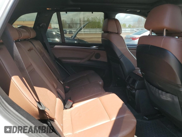 2012 BMW X5 35i z VIN 5UXZV4C59CL759335, wystawiony jako Copart lot #57055065 z przebiegiem 180 589 mil mil oraz Czysty tytuł • Clean title. Historia ofert i sprzedaży dostępna na DreamBid. Obrazek 11.