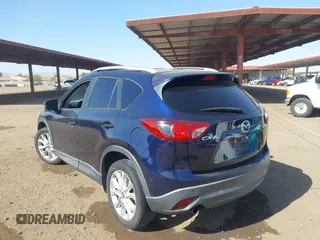2014 Mazda CX-5 Grand Touring with VIN JM3KE2DY2E0349343, listed as a IAAI auction lot 41725214 with 271,094 mi miles. Bid and sale history available at carsss.com. Image 3.