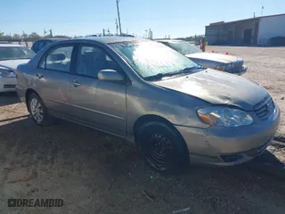 2004 Toyota Corolla CE with VIN JTDBR32E042021756, listed as a IAAI auction lot 41821929 with 299,999 mi miles. Bid and sale history available at carsss.com. Image 1.