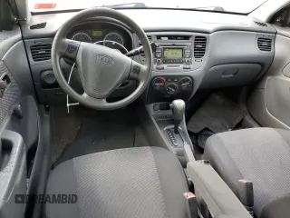2009 Kia Rio LX with VIN KNADE223396548989, listed as a Copart auction lot 64964304 with 150,426 mi miles and Salvage Title. Bid and sale history available at carsss.com. Image 8.