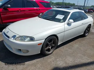 1997 Lexus SC 300 with VIN JT8CD32Z2V0039032, listed as a IAAI auction lot 42556454 with 164,629 mi miles and . Bid and sale history available at DreamBid. Image 2.