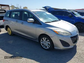 2012 Mazda 5 Sport z VIN JM1CW2BL9C0117627, wystawiony jako IAAI lot #42403991 z przebiegiem 124 239 mil mil oraz . Historia ofert i sprzedaży dostępna na DreamBid. Obrazek 1.