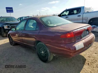 1999 Ford Contour LX with VIN 1FAFP66L2XK167281, listed as a Copart auction lot 64839335 with 256,227 mi miles and Clean title. Bid and sale history available at DreamBid. Image 2.