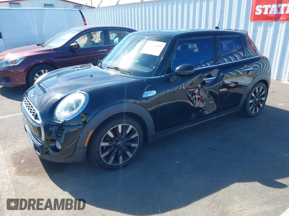 2015 MINI Hardtop 4 Door S z VIN WMWXU3C58F2B57218, wystawiony jako IAAI lot #42361437 z przebiegiem 96 984 mil mil oraz . Historia ofert i sprzedaży dostępna na DreamBid. Obrazek 17.