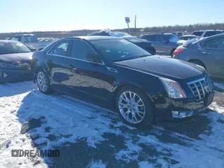 2013 Cadillac CTS Premium z VIN 1G6DS5E34D0160676, wystawiony jako IAAI lot #41262795 z przebiegiem 122 248 mil mil oraz . Historia ofert i sprzedaży dostępna na DreamBid. Obrazek 1.