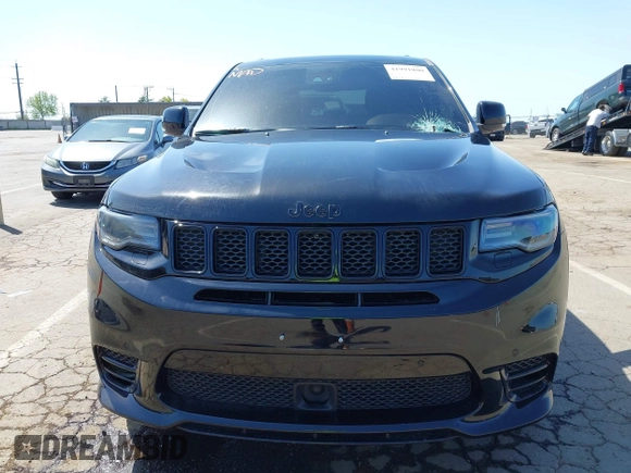 2020 Jeep Grand Cherokee Trackhawk with VIN 1C4RJFN96LC336561, listed as a IAAI auction lot 41991800 with 58,781 mi miles and . Bid and sale history available at DreamBid. Image 12.