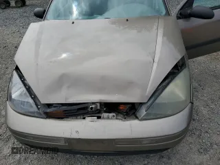2004 Ford Focus LX with VIN 1FAFP33P24W148563, listed as a Copart auction lot 63869755 with 142,243 mi miles and Salvage title. Bid and sale history available at DreamBid. Image 11.