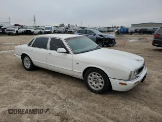 1998 Jaguar XJ with VIN SAJHX1248WC835728, listed as a Copart auction lot 86698244 with 116,768 mi miles and Clean title. Bid and sale history available at DreamBid. Image 4.