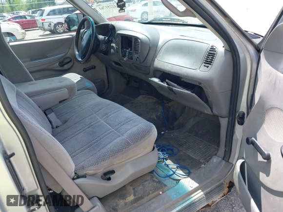 1998 Ford F-150 with VIN 1FTZX1767WNB79135, listed as a IAAI auction lot 42251761 with 221,839 mi miles and . Bid and sale history available at DreamBid. Image 5.