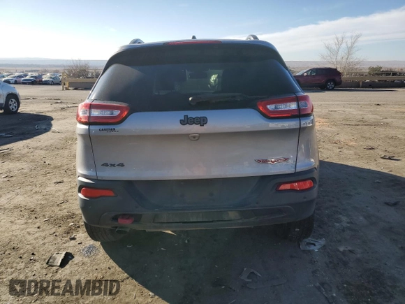 2018 Jeep Cherokee Trailhawk with VIN 1C4PJMBB9JD571773, listed as a Copart auction lot 82876514 with 137,565 mi miles and Salvage title. Bid and sale history available at DreamBid. Image 6.