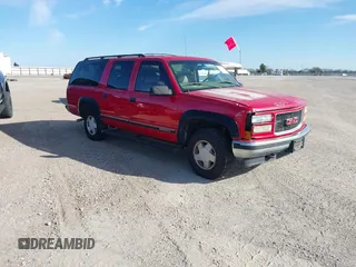 1999 GMC Suburban with VIN 1GKFK16RXXJ809823, listed as a IAAI auction lot 41687406 with 360,799 mi miles. Bid and sale history available at carsss.com. Image 1.