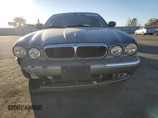 2004 Jaguar XJ with VIN SAJWA71C74SG20299, listed as a Copart auction lot 79469504 with 78,134 mi miles and Salvage Title. Bid and sale history available at carsss.com. Image 5.