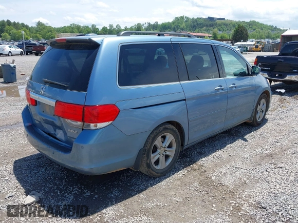 2010 Honda Odyssey Touring with VIN 5FNRL3H93AB058240, listed as a IAAI auction lot 42211192 with 223,859 mi miles and . Bid and sale history available at DreamBid. Image 4.