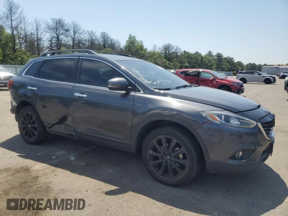 2014 Mazda CX-9 Grand Touring with VIN JM3TB3DV9E0444720, listed as a Copart auction lot 63687855 with 144,568 mi miles and Salvage title. Bid and sale history available at DreamBid. Image 4.