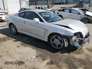 2006 Hyundai Tiburon GT z VIN KMHHN65F76U190851, wystawiony jako Copart lot #45935795 z przebiegiem 102 335 mil mil oraz Szkoda całkowita • Salvage title. Historia ofert i sprzedaży dostępna na DreamBid. Obrazek 4.