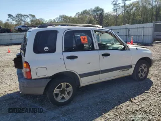 2003 Chevrolet Tracker z VIN 2CNBE13C736912038, wystawiony jako Copart lot #80422844 z przebiegiem 242 512 mil mil oraz Szkoda całkowita • Salvage title. Historia ofert i sprzedaży dostępna na DreamBid. Obrazek 3.