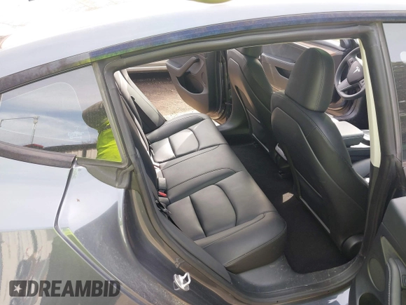 2023 Tesla Model 3 with VIN 5YJ3E1EA6PF567170, listed as a IAAI auction lot 41837040 with 36,193 mi miles and . Bid and sale history available at DreamBid. Image 8.
