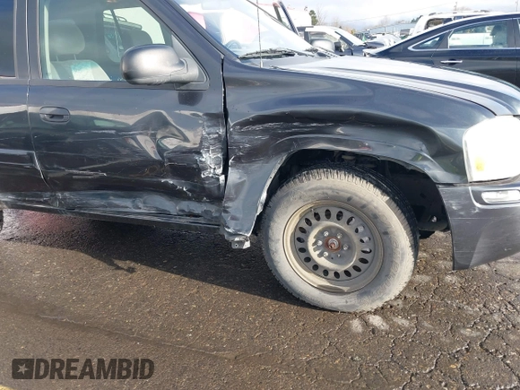 2003 GMC Envoy SLT with VIN 1GKDT13S732283859, listed as a IAAI auction lot 41219105 with 172,953 mi miles. Bid and sale history available at carsss.com. Image 6.