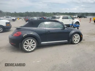 2014 Volkswagen Beetle 1.8T w/Premium z VIN 3VW517AT6EM816698, wystawiony jako Copart lot #57344055 z przebiegiem 52 782 mil mil oraz Szkody całkowita. Historia ofert i sprzedaży dostępna na DreamBid. Obrazek 3.