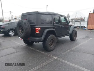 2022 Jeep Wrangler Unlimited Rubicon with VIN 1C4HJXFGXNW127064, listed as a IAAI auction lot 41491203 with 47,700 mi miles and . Bid and sale history available at DreamBid. Image 4.
