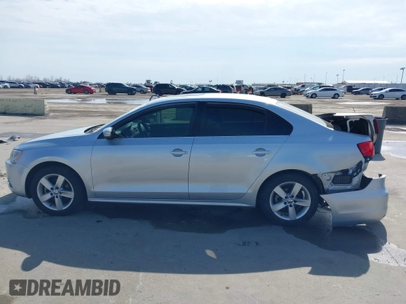 2014 Volkswagen Jetta TDI w/Premium with VIN 3VWLL7AJ6EM424935, listed as a IAAI auction lot 41533634 with 64,028 mi miles and . Bid and sale history available at DreamBid. Image 14.
