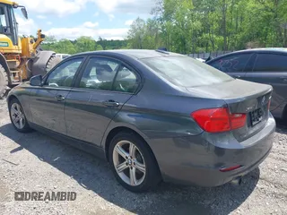 2014 BMW 3 Series 320i xDrive with VIN WBA3C3C57EP662795, listed as a IAAI auction lot 42267683 with 153,451 mi miles and . Bid and sale history available at DreamBid. Image 3.