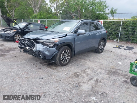 2023 Toyota Corolla Cross XLE with VIN 7MUDAAAGXPV070263, listed as a IAAI auction lot 42394307 with 18,977 mi miles and . Bid and sale history available at DreamBid. Image 2.