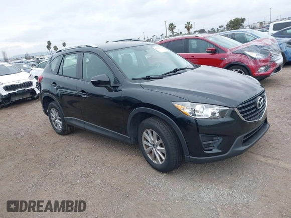 2016 Mazda CX-5 Sport with VIN JM3KE2BY4G0761933, listed as a IAAI auction lot 41709274 with 131,127 mi miles. Bid and sale history available at carsss.com. Image 1.