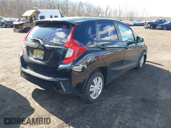 2015 Honda Fit LX z VIN 3HGGK5H51FM775176, wystawiony jako IAAI lot #41690648 z przebiegiem 49 979 mil mil oraz . Historia ofert i sprzedaży dostępna na DreamBid. Obrazek 4.