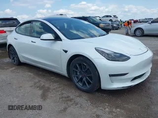 2023 Tesla Model 3 with VIN 5YJ3E1EA5PF407054, listed as a IAAI auction lot 42313770 with 57,621 mi miles and . Bid and sale history available at DreamBid. Image 1.