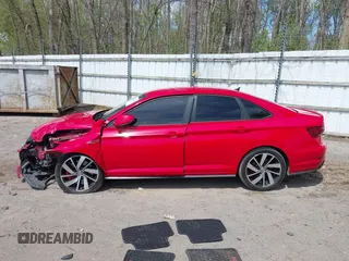 2019 Volkswagen Jetta GLI S z VIN 3VW6T7BU3KM255295, wystawiony jako IAAI lot #42173746 z przebiegiem 63 526 mil mil oraz . Historia ofert i sprzedaży dostępna na DreamBid. Obrazek 14.