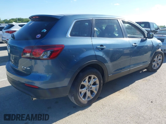 2015 Mazda CX-9 Sport z VIN JM3TB2BAXF0465720, wystawiony jako IAAI lot #42305436 z przebiegiem 130 543 mil mil oraz . Historia ofert i sprzedaży dostępna na DreamBid. Obrazek 4.
