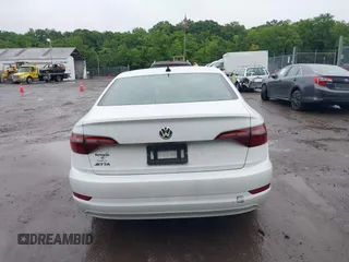2021 Volkswagen Jetta S z VIN 3VWC57BU9MM103778, wystawiony jako IAAI lot #42493041 z przebiegiem 74 723 mil mil oraz . Historia ofert i sprzedaży dostępna na DreamBid. Obrazek 16.