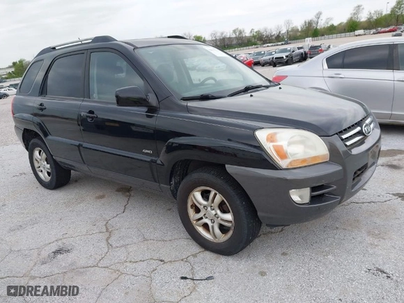 2007 Kia Sportage LX with VIN KNDJE723077397667, listed as a IAAI auction lot 42011122 with 218,744 mi miles. Bid and sale history available at carsss.com. Image 1.