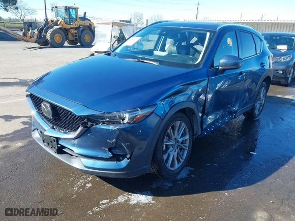 2021 Mazda CX-5 Grand Touring with VIN JM3KFBDM7M0311552, listed as a IAAI auction lot 41856871 with 47,330 mi miles. Bid and sale history available at carsss.com. Image 2.