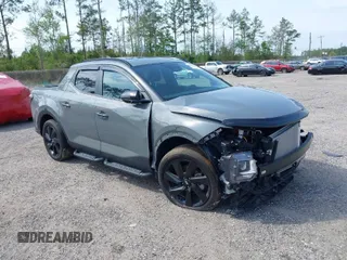 2023 Hyundai Santa Cruz Night Edition z VIN 5NTJCDAF0PH054192, wystawiony jako IAAI lot #40734723 z przebiegiem 9 700 mil mil oraz . Historia ofert i sprzedaży dostępna na DreamBid. Obrazek 1.