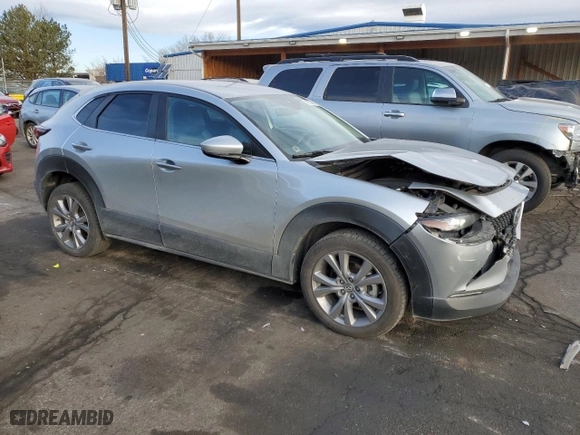 2021 Mazda CX-30 Select with VIN 3MVDMBBL9MM256633, listed as a Copart auction lot 48739405 with 76,871 mi miles and Salvage Title. Bid and sale history available at carsss.com. Image 4.
