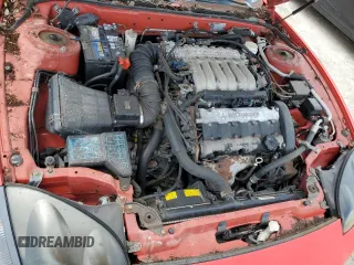 1999 Mitsubishi 3000GT GT z VIN JA3AM84J4XY001608, wystawiony jako Copart lot #64366944 z przebiegiem 153 804 mil mil oraz Tytuł czysty. Historia ofert i sprzedaży dostępna na DreamBid. Obrazek 11.