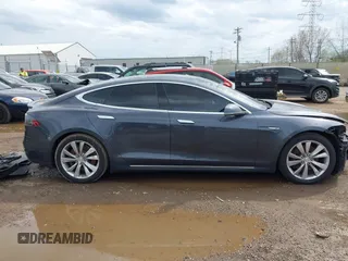 2015 Tesla Model S 85D with VIN 5YJSA1E21FF116775, listed as a IAAI auction lot 41876772 with 128,805 mi miles. Bid and sale history available at carsss.com. Image 14.