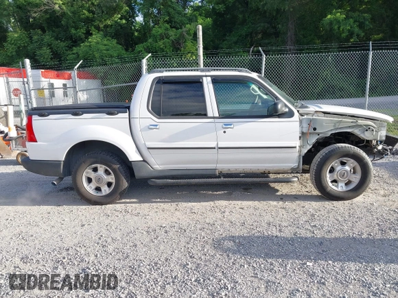 2003 Ford Explorer Sport Trac XLS z VIN 1FMZU77E33UA26042, wystawiony jako IAAI lot #42524905 z przebiegiem 124 878 mil mil oraz . Historia ofert i sprzedaży dostępna na DreamBid. Obrazek 13.