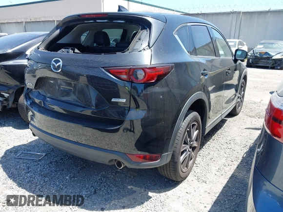 2018 Mazda CX-5 Grand Touring with VIN JM3KFADM4J0326760, listed as a IAAI auction lot 41885100 with 82,091 mi miles and . Bid and sale history available at DreamBid. Image 4.