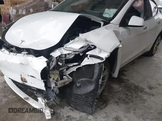 2023 Tesla Model Y Long Range z VIN 7SAYGAEEXPF789037, wystawiony jako IAAI lot #41551605 z przebiegiem 8 630 mil mil oraz . Historia ofert i sprzedaży dostępna na DreamBid. Obrazek 6.