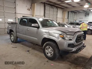 2021 Toyota Tacoma SR z VIN 5TFAX5GN1MX189219, wystawiony jako IAAI lot #41464122 z przebiegiem 65 838 mil mil oraz . Historia ofert i sprzedaży dostępna na DreamBid. Obrazek 1.